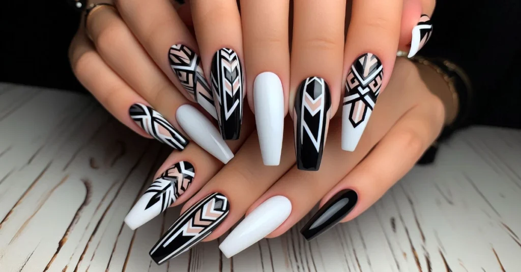 Bold geometric design on long coffin nails using contrasting black and white colors.